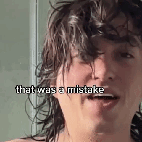 Woman Saying Which I Realize Was a Really Big Mistake in Front of Ironing Board