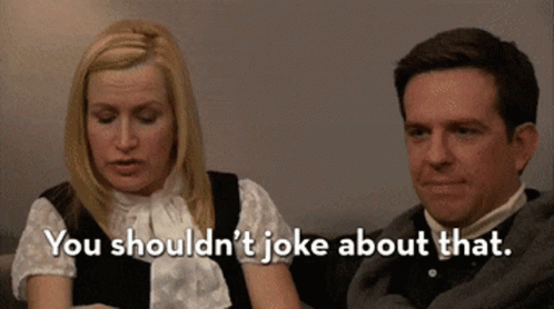 Woman Saying You Shouldn't Joke About That to Man Sitting Beside Her