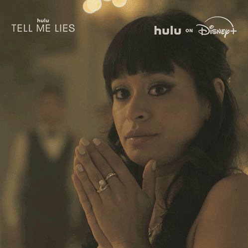 Woman Saying Yup in Front of Tell Me Lies Sign