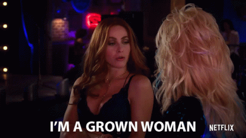 Woman Says I'm a Grown Woman in Front of Neon Sign