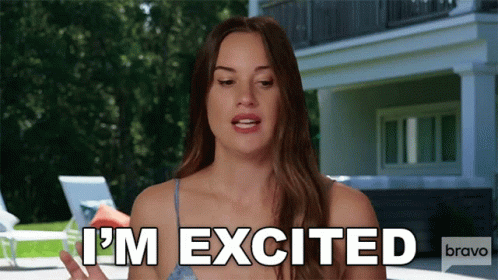 Woman Says I'm Excited in Front of Large House