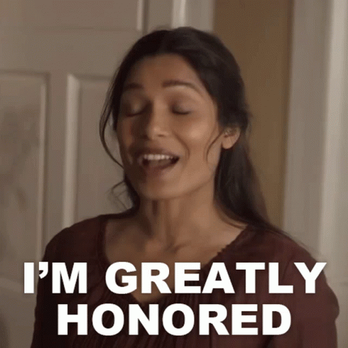 Woman Says I'm Greatly Honored In Front Of Door GIF