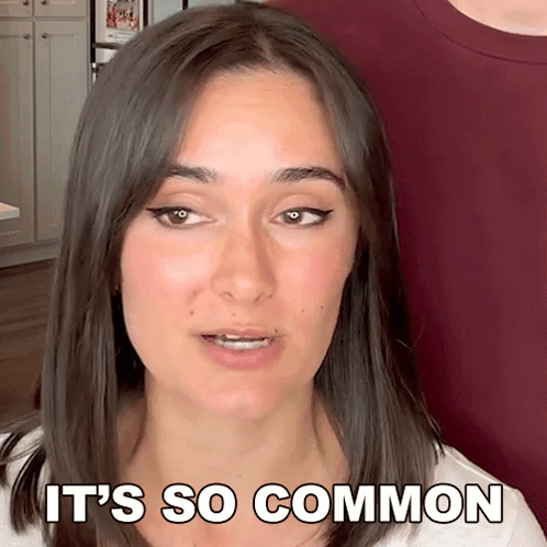 Woman Says It's So Common In Front Of Man In Red Shirt GIF
