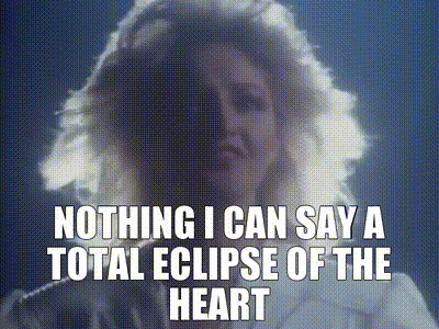 Woman Says Nothing I Can Say a Total Eclipse of the Heart Wearing Headphones
