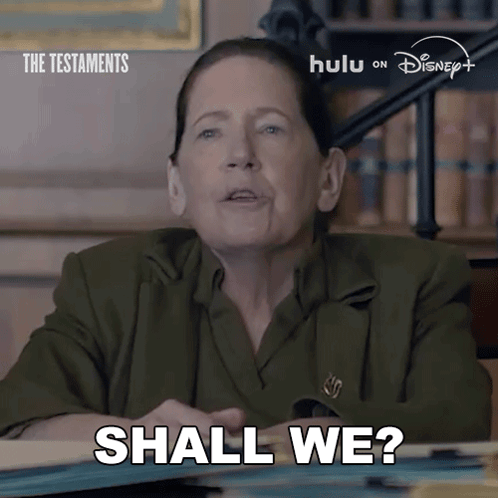 Woman Says Shall We With The Testaments Sign GIF