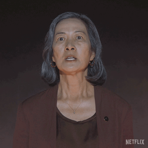 Woman Says Stop in Front of Netflix Sign