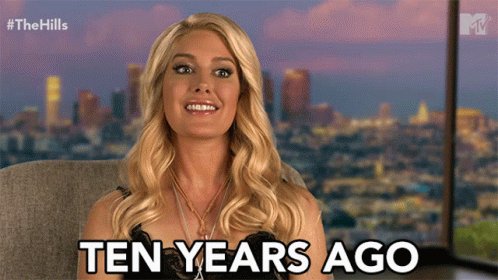 Woman Says Ten Years Ago In Front Of Cityscape GIF