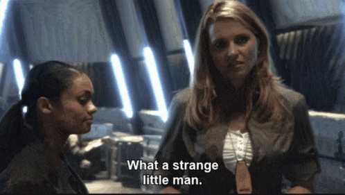 Woman Says What a Strange Little Man in Front of Another Woman