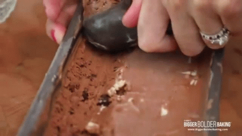 Woman Scooping Ice Cream from Loaf Pan