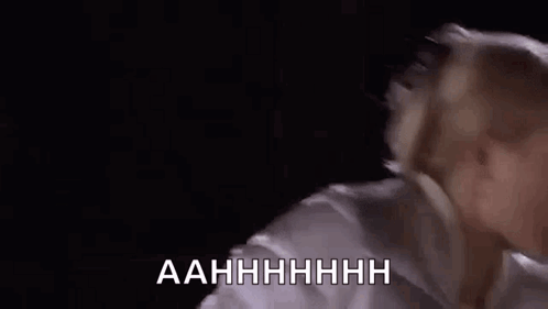 Woman Screaming Mouth Wide Open in White Shirt