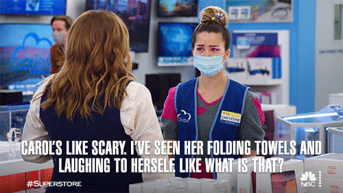 Woman Seen Carol Folded Towels Laughing Scary GIF