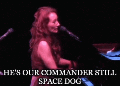 Woman Singing He's Our Commander Still Space Dog