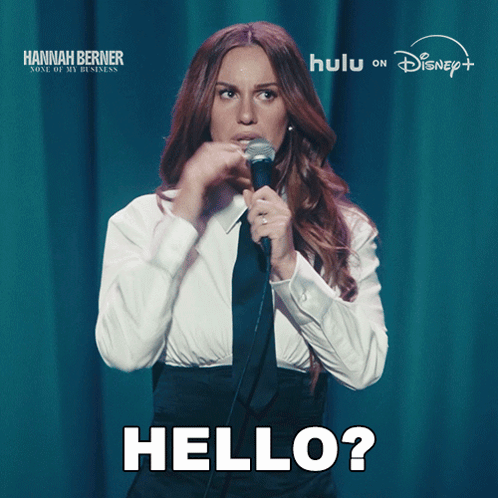 Woman Singing Hello Into Microphone