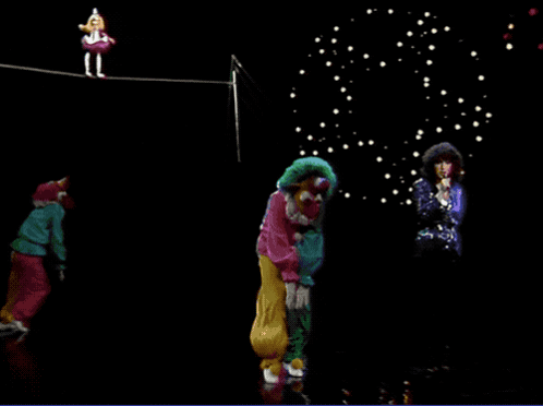 Woman Singing In Front Of Clowns On A Rope GIF