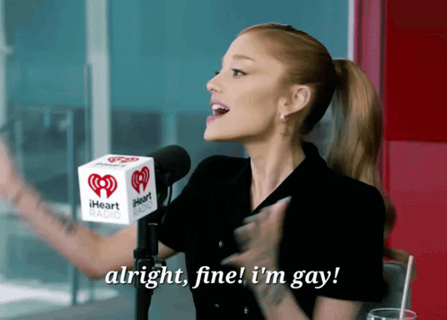 Woman Singing Into IHeart Radio Microphone Saying Alright Fine I'm Gay