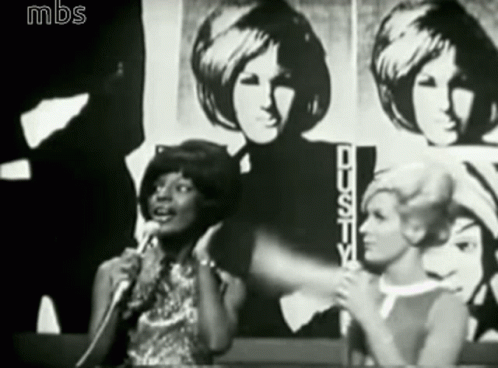 Woman Singing Into Microphone
