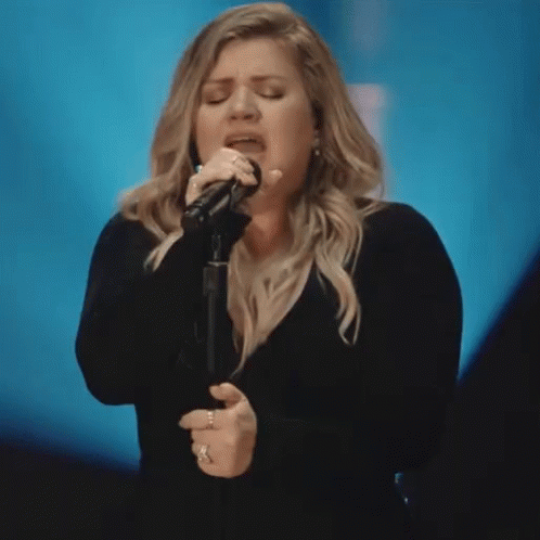 Woman Singing Into Microphone Careful