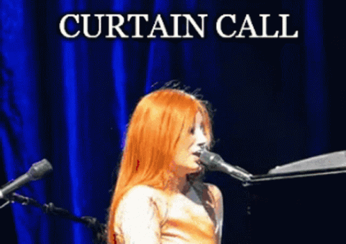 Woman Singing Into Microphone Curtain Call