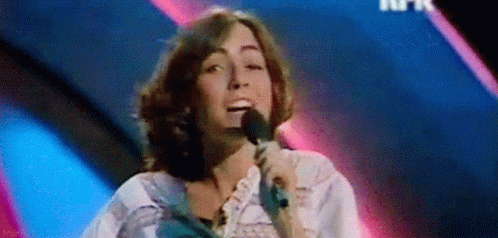 Woman Singing Into Microphone