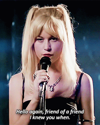 Woman Singing Into Microphone Hello Again Friend of a Friend I Knew You When