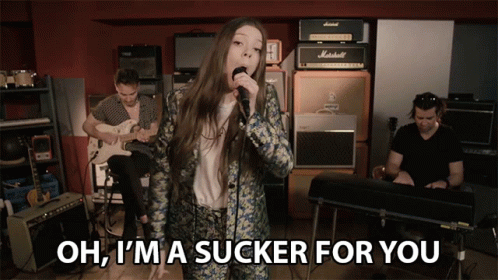 Woman Singing Into Microphone Oh I'm A Sucker For You GIF
