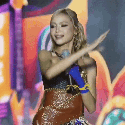Woman Singing Into Microphone On Stage Dancing GIF