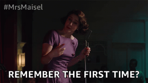 Woman Singing Into Microphone Remember the First Time
