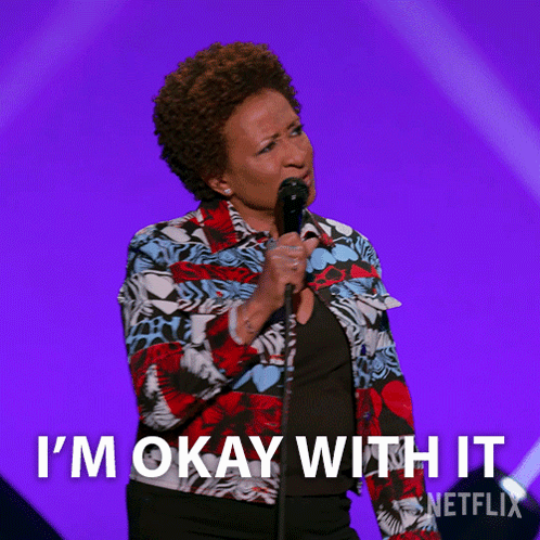 Woman Singing Into Microphone Saying I'm Okay With It