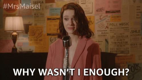 Woman Singing Into Microphone Saying Why Wasn't I Enough