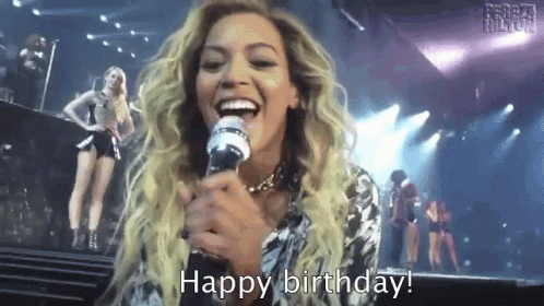 Woman Singing Into Microphone Says Happy Birthday