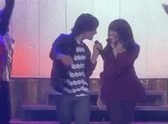 Woman Singing Into Microphone