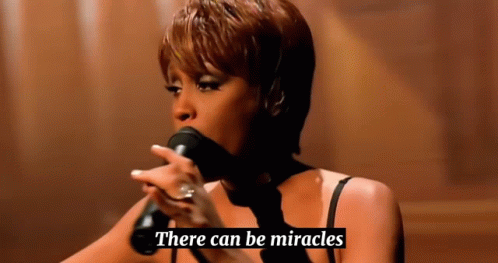 Woman Singing Into Microphone There Can Be Miracles