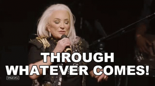 Woman Singing Into Microphone Through Whatever Comes
