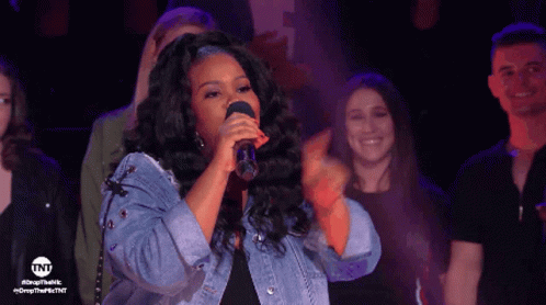 Woman Singing Into Microphone TNT