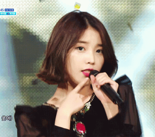 Woman Singing Into Microphone With 45 GIF