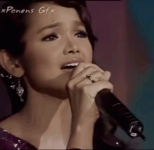 Woman Singing Into Microphone With Xpones Gfx