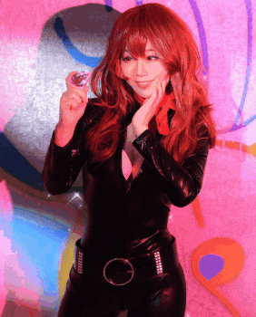 Woman Singing Into Purple Microphone