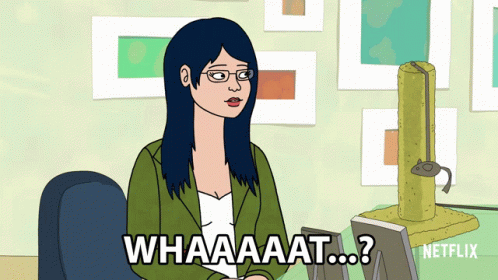 Woman Sitting at Desk Saying What