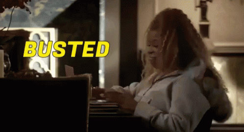 Woman Sitting at Desk with Busted Behind
