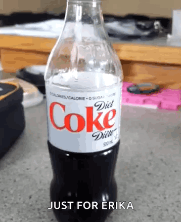 Woman Sitting at Desk with Coke