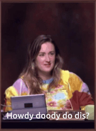 Woman Sitting at Desk with Laptop
