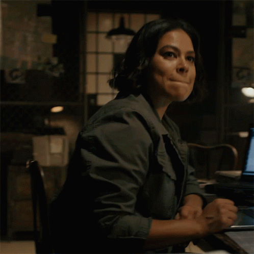 Woman Sitting at Desk With Laptop Saying Copy