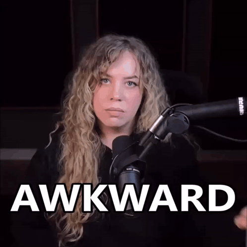 Woman Sitting at Microphone Saying Awkward