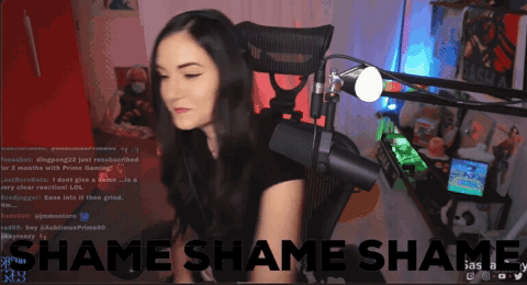 Woman Sitting at Microphone Saying Shame Shame Shame