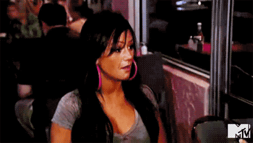 Woman Sitting at Restaurant Table with Open Mouth