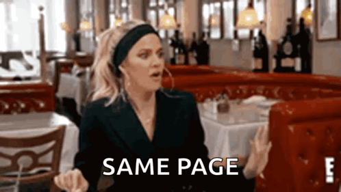 Woman Sitting At Restaurant Table With Same Page GIF