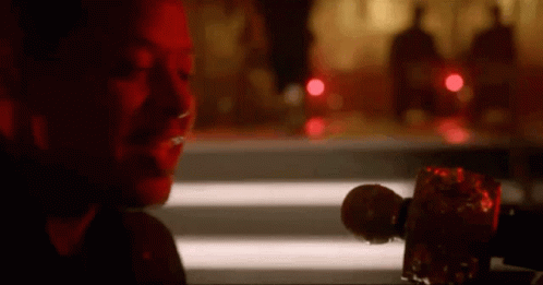 Woman Sitting At Table Holding Microphone GIF