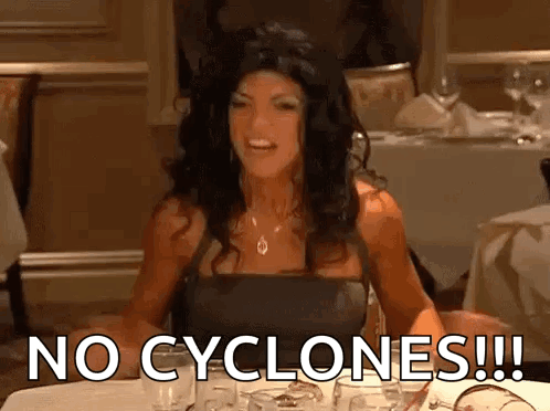Woman Sitting At Table Saying No Cyclones GIF