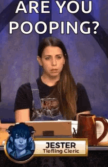 Woman Sitting at Table With Are You Pooping Sign