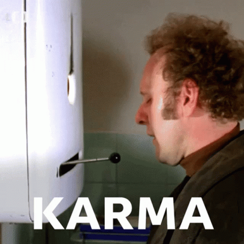 Woman Sitting at Table With Beer Saying Karma Will Find You